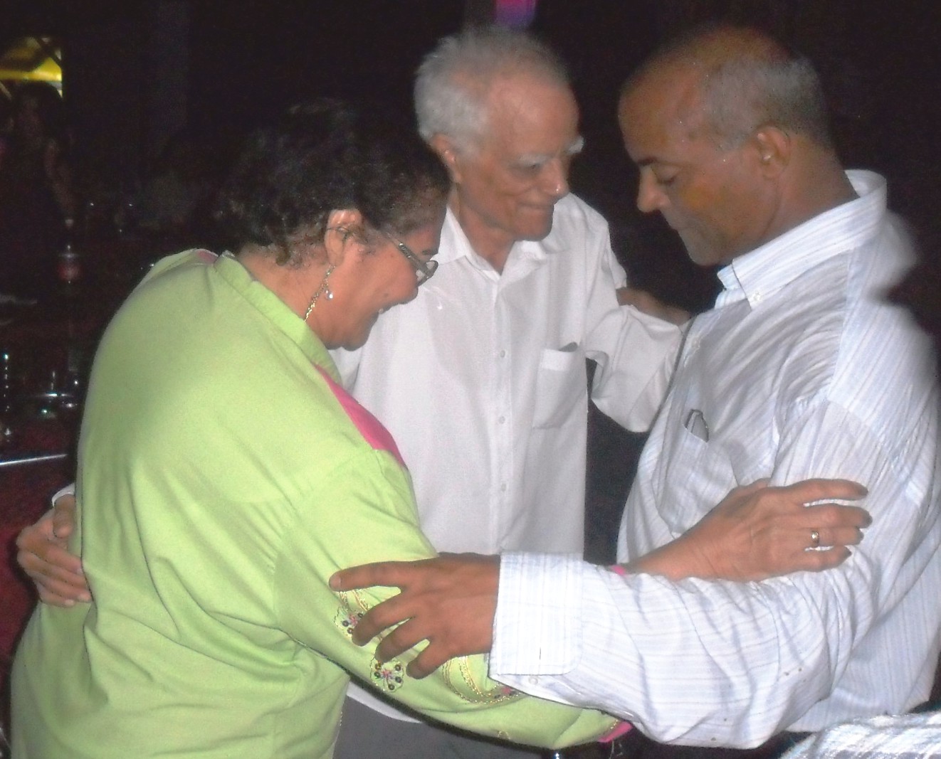 Eloina, Vitelio and Leonel at a celebration event
