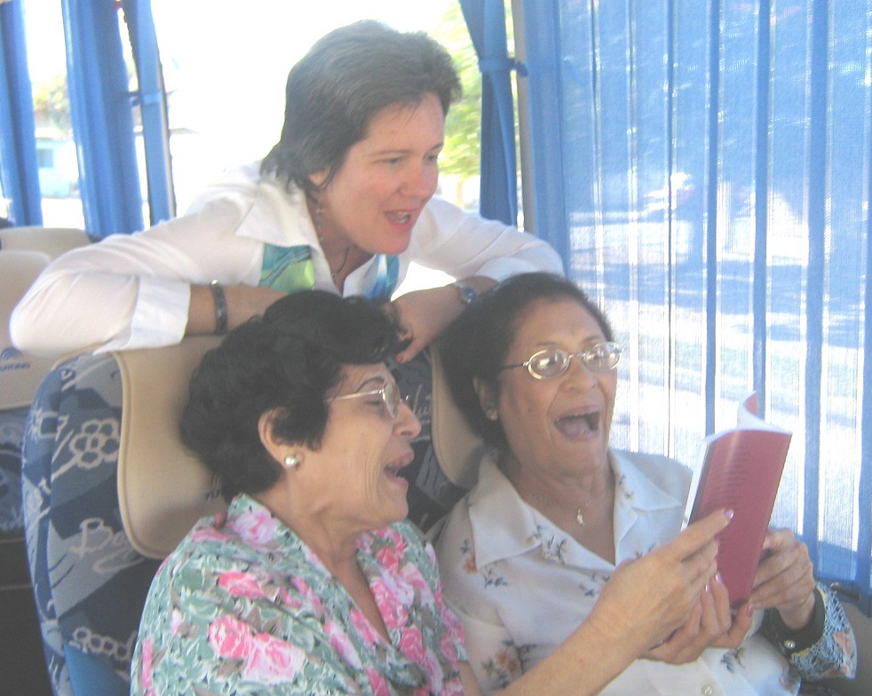 Nancy, Celia and Eloina singing in the bus during a scientific caravan
